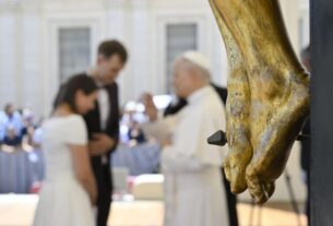 Pope Leo blesses a married couple during his July 30, 2025, general audience.