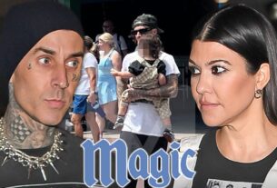 Travis Barker segura o filho Rocky, fica com a família no Magic Kingdom