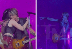 Keith Urban Points em Maggie Baugh no palco durante a mudança de letra 'Love You'